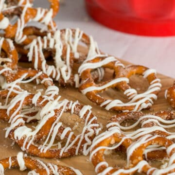 Cinnamon sugar pretzels closeup with white chocolate drizzle.