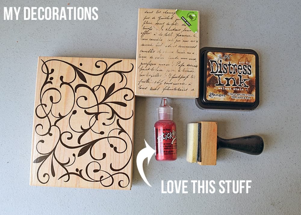 Stamping supplies including ink, stamps, ink distresser, and dimensional glitter glue.