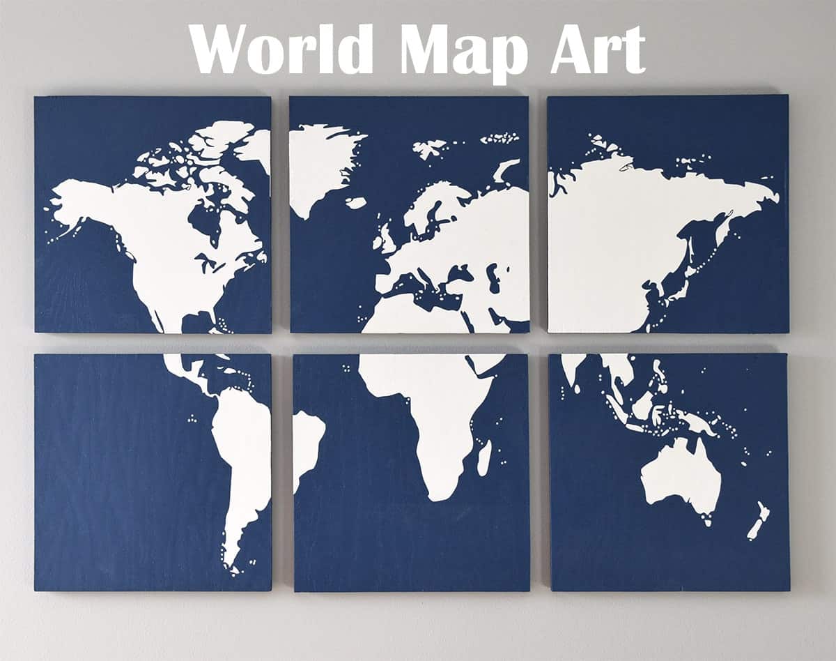 DIY World map wall art on gray wall with blue sectioned pieces with white map silhouette.