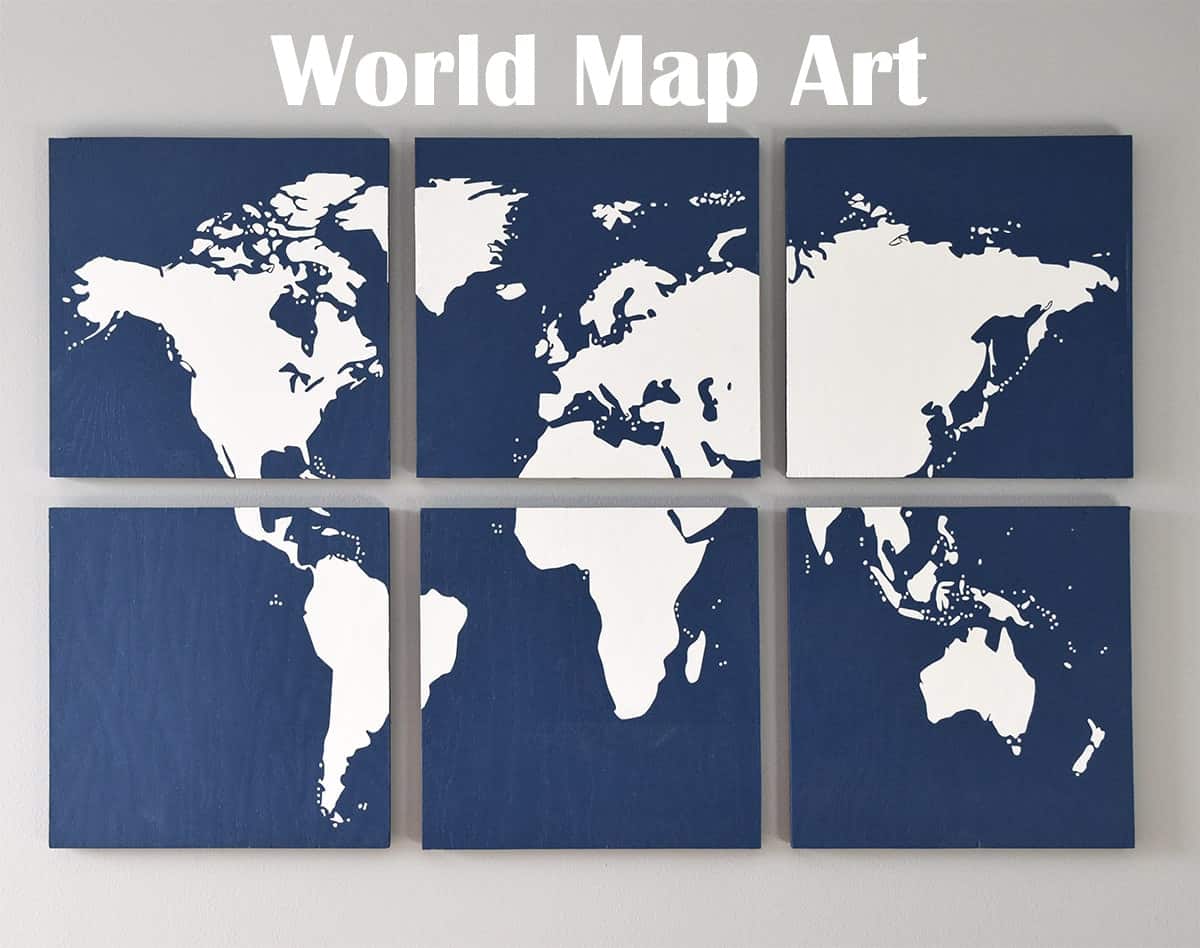 DIY World map wall art on gray wall with blue sectioned pieces with white map silhouette. 