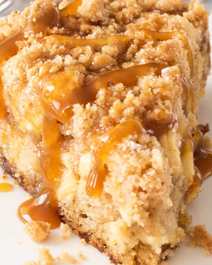 Closeup of Apple Crumb Cake slice with caramel drizzle.