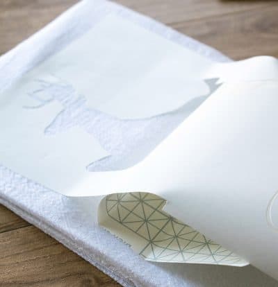 The right way to lay a stencil without bubbles.