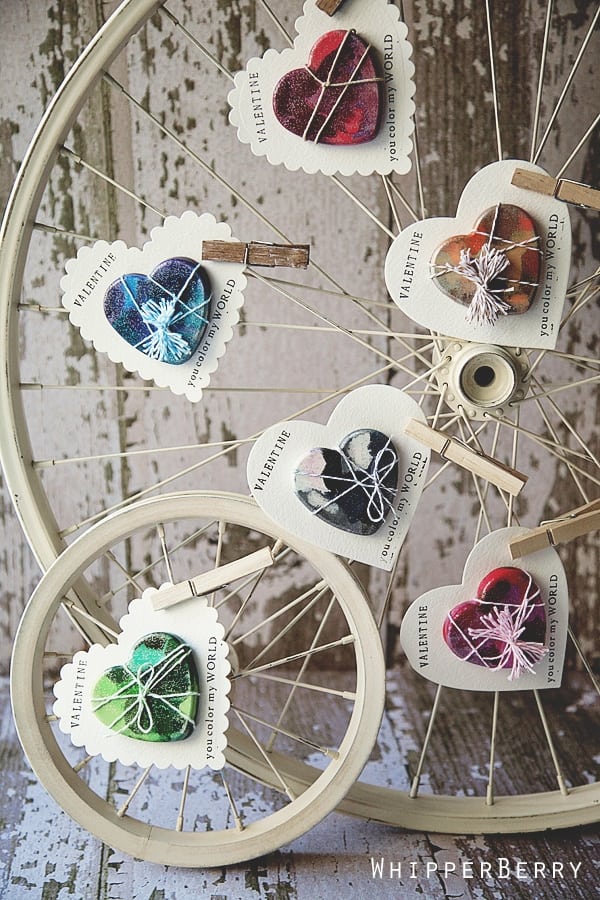 Melted Crayon Heart valentines clothes-pinned to antiqued bicycle wheel