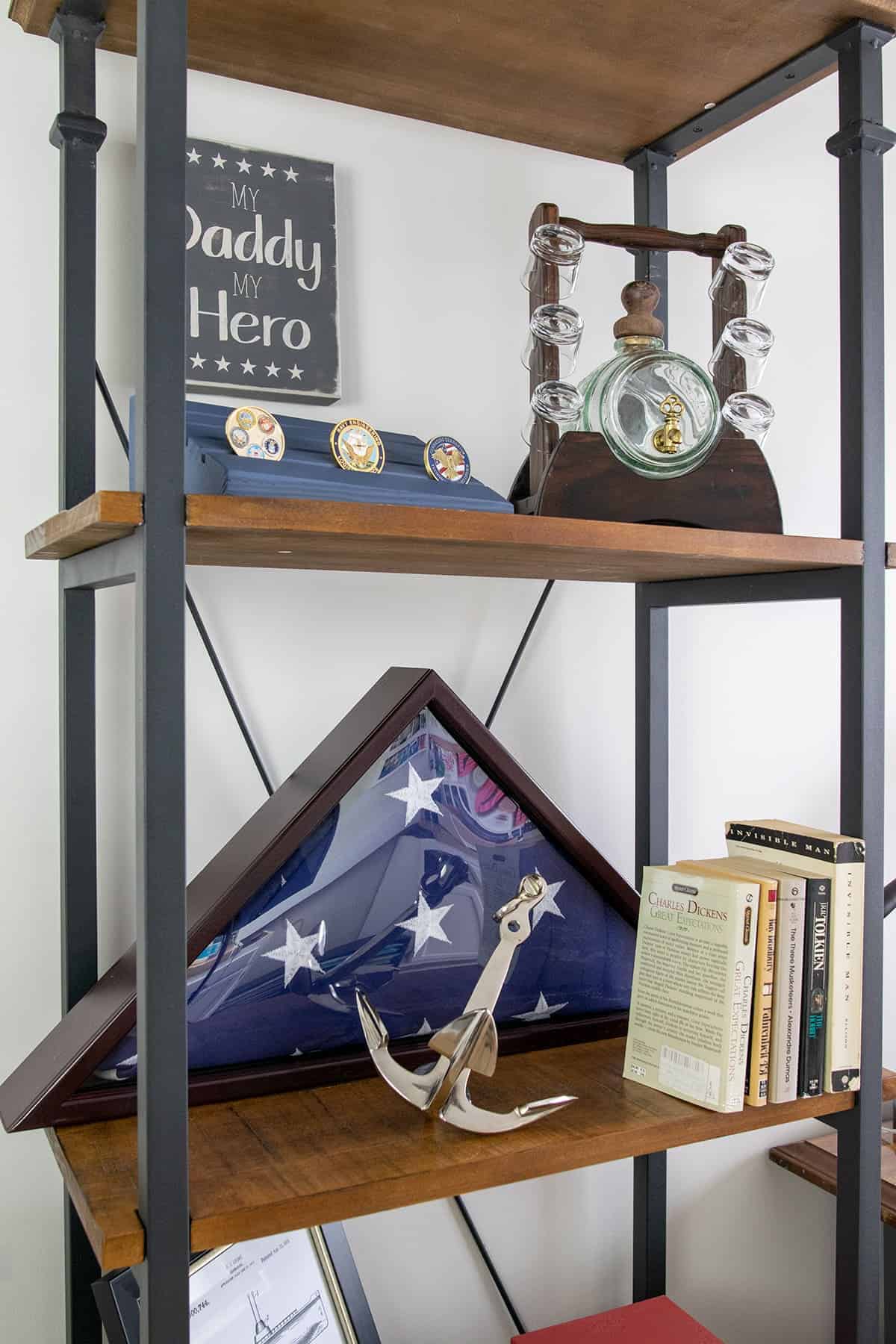 Industrial shelves with wood and black metal with patriotic decor and books.