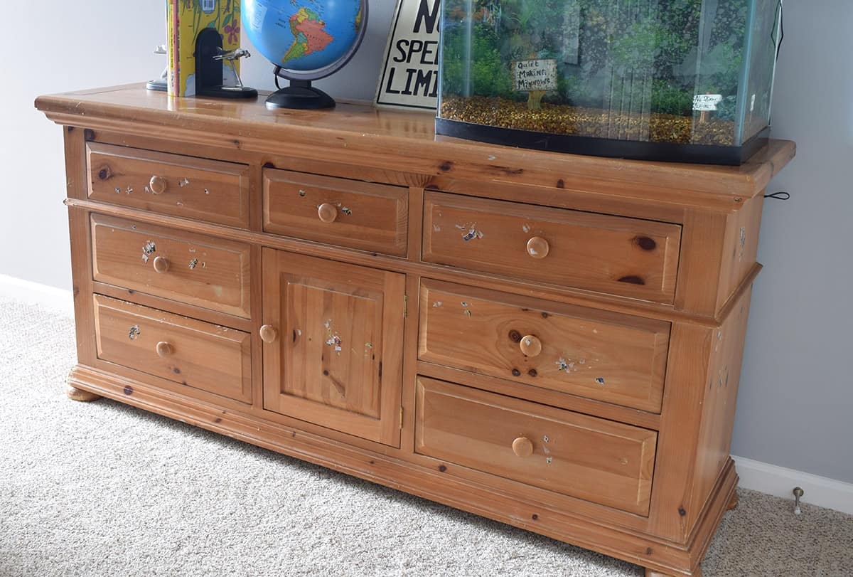 Knotty pine dresser before refinishing and painting.