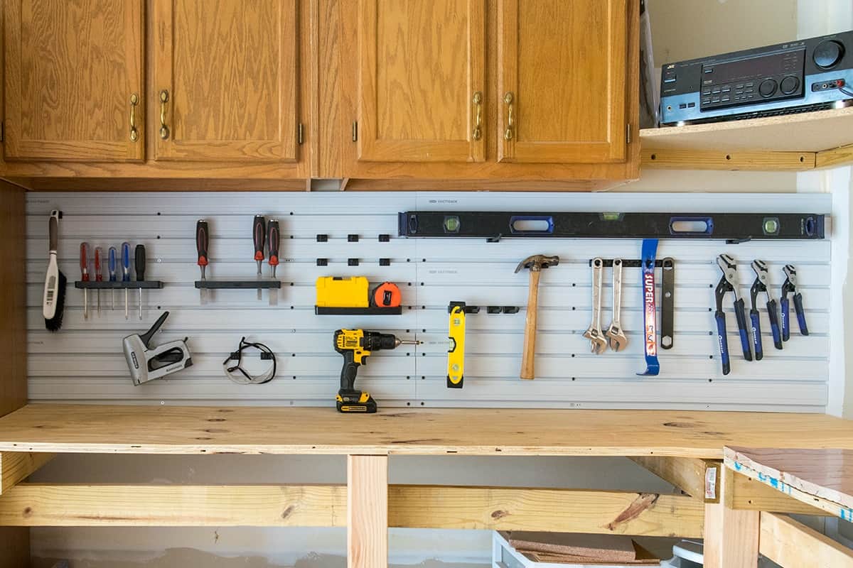 Tool organization in the garage on the wall with slat walls.