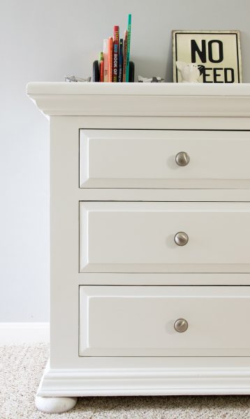 White painted dresser with three drawers.