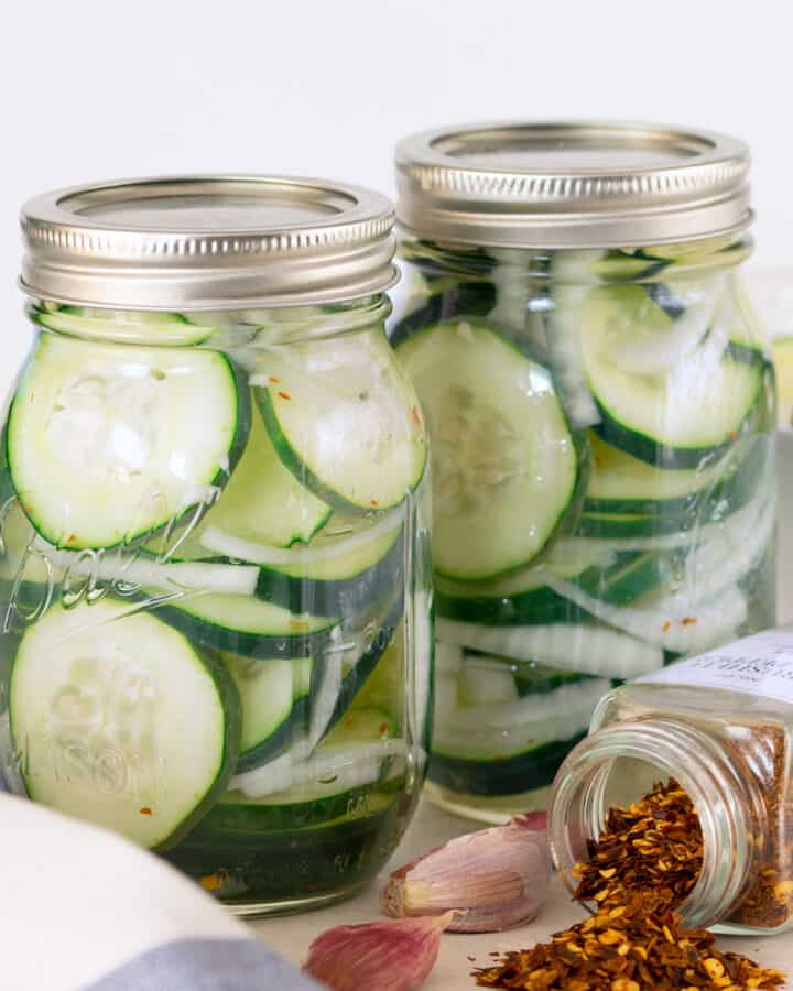 Cucumber salad in canning jars.