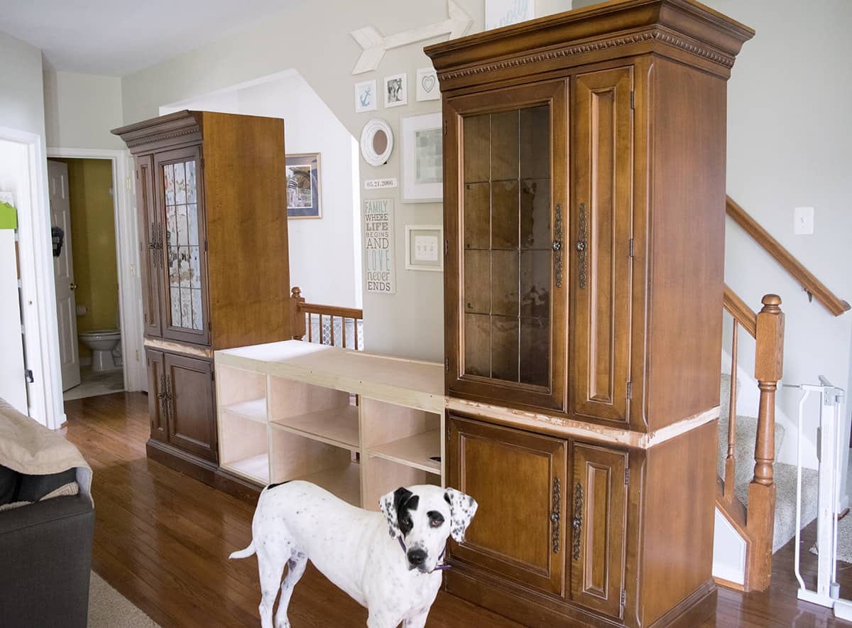 Progress of adding newly built center console shelving in DIY entertainment center makeover. 