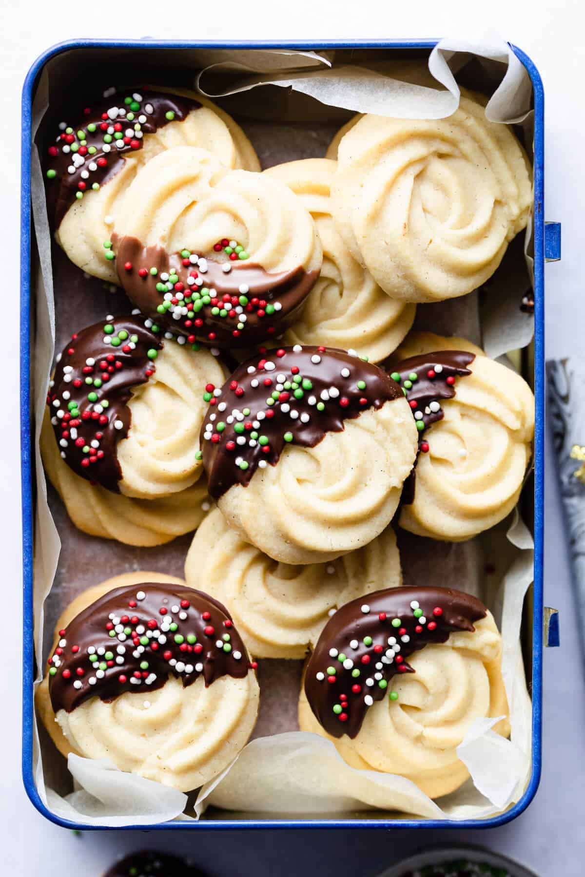 Butter Cookies piped in beautiful swirls and dipped in chocolate.