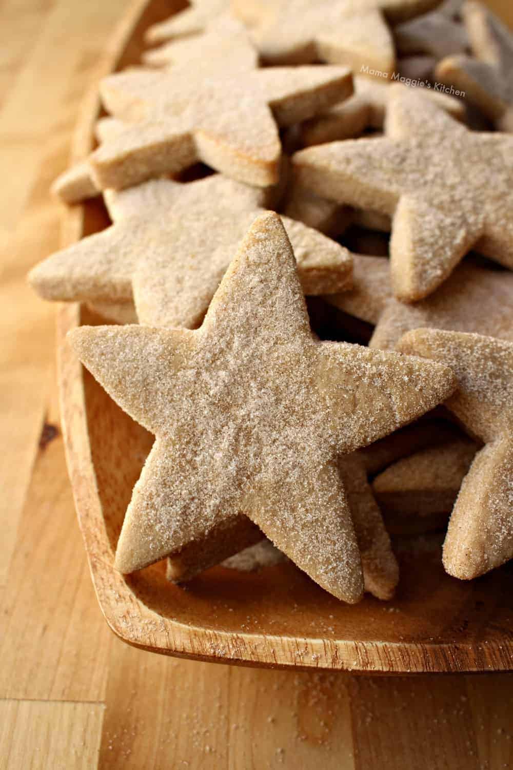 Horjarascasv Mexican Shortbread cookies shaped into stars on a cookie plate.