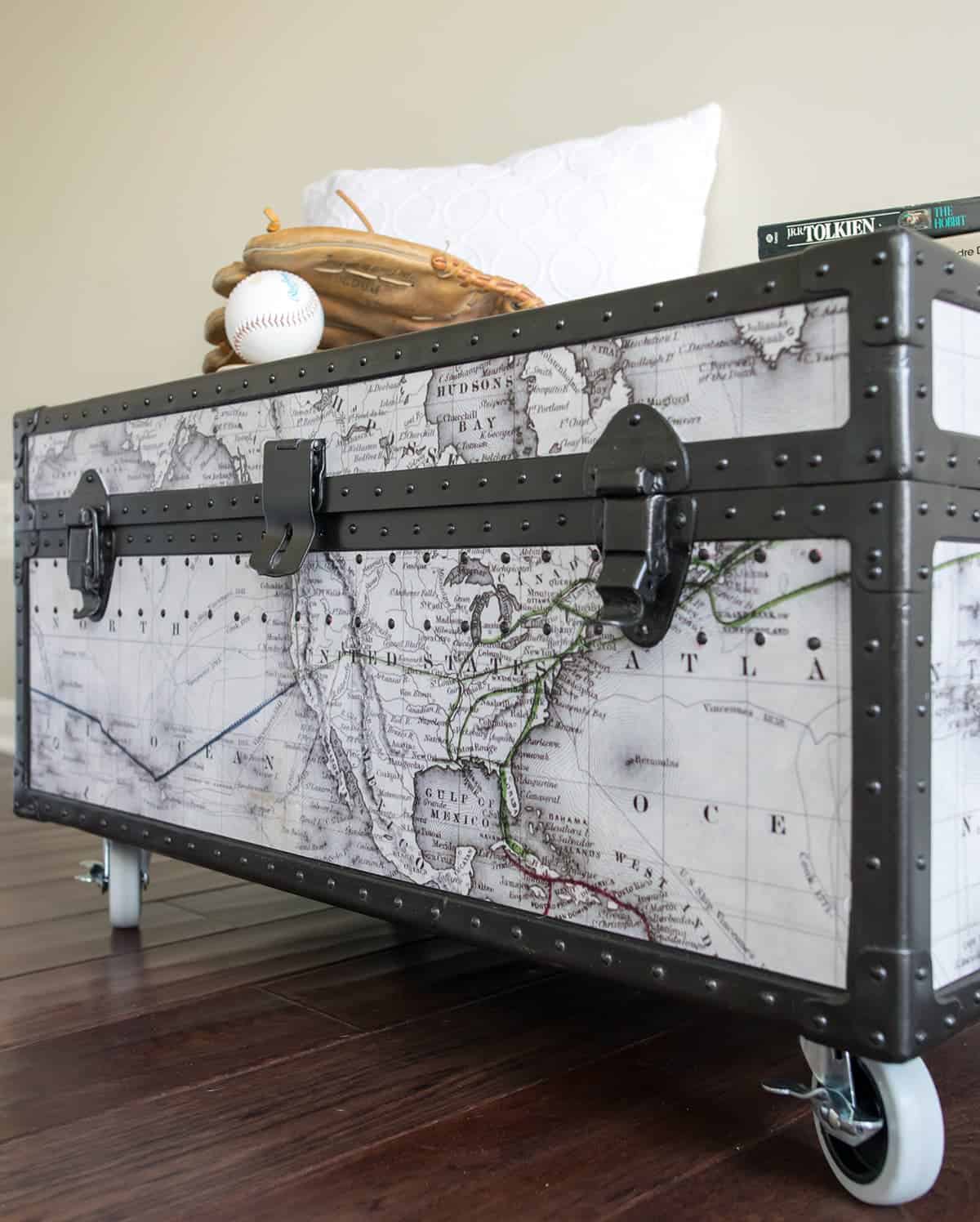 Vintage military trunk makeover with world map showing the front side. Painted with  Rust oleum oil rubbed bronze metal paint.