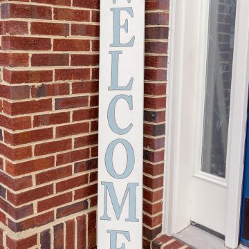 DIY wood welcome sign on the front porch with DecoArt sky blue