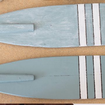 Whitewashed boating oars in soft blue before and after painting.