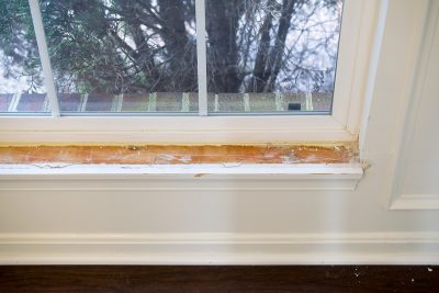 Window frame with sill removed from the wall.