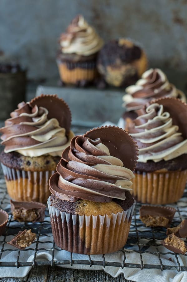 Reeses-Cupcakes with chocolate and peanut butter swirl frosting with reese's cup garnish