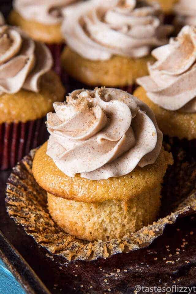 Swirled Cinnamon buttercream on freshly baked cupcake with dusting of sweet cinnamon sugar 