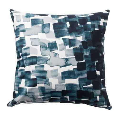 Pillow with blue swatches.