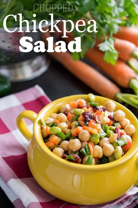 Delicious Summer Chickpea Salad consisting of delicious chopped salad with lots of veggies, cranberries, and a tangy vinaigrette dressing.
