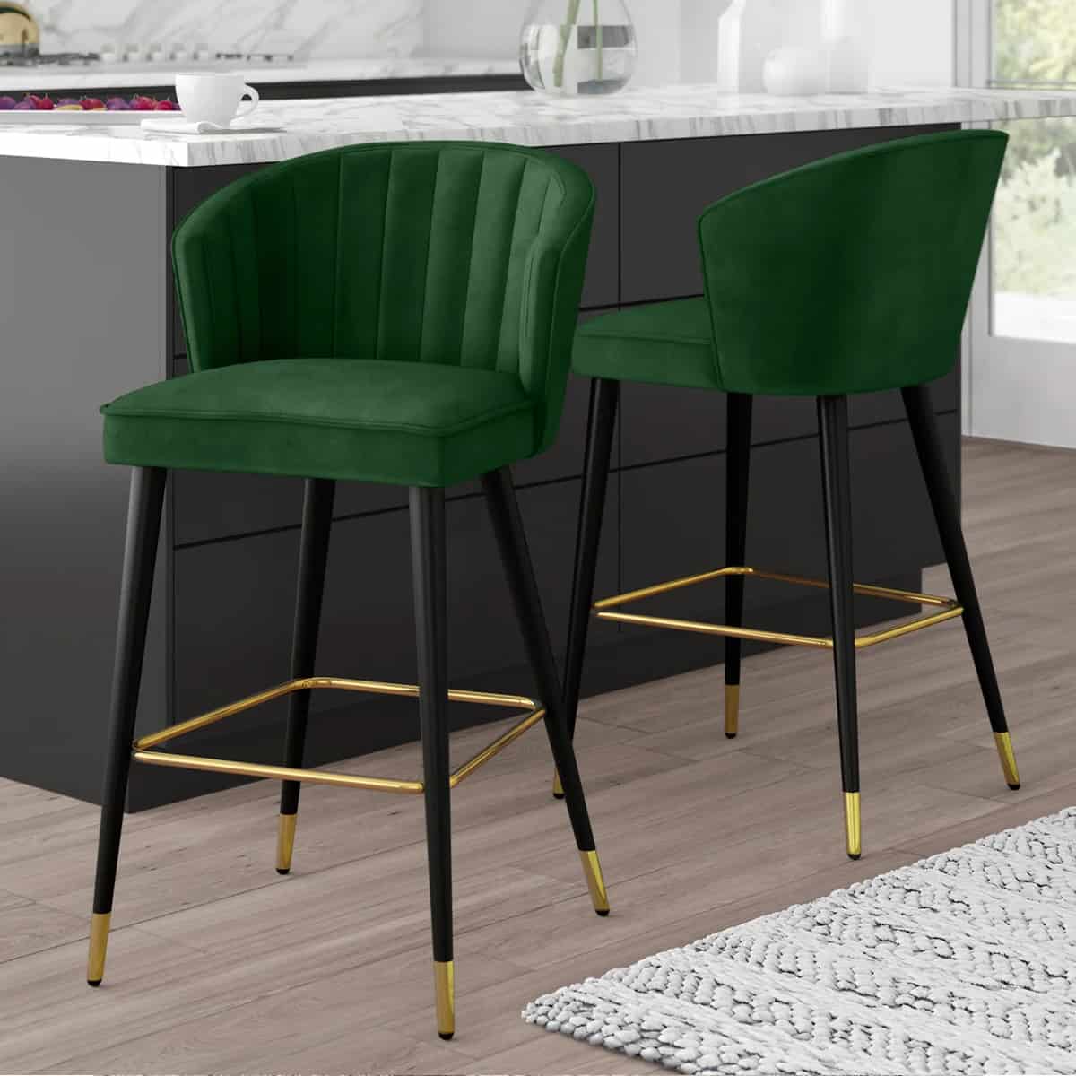 Green mid century bar stools with plush cushions with a back.