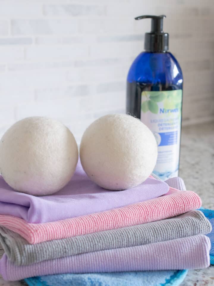 Norwex cloths in the foreground and a bottle in the background.