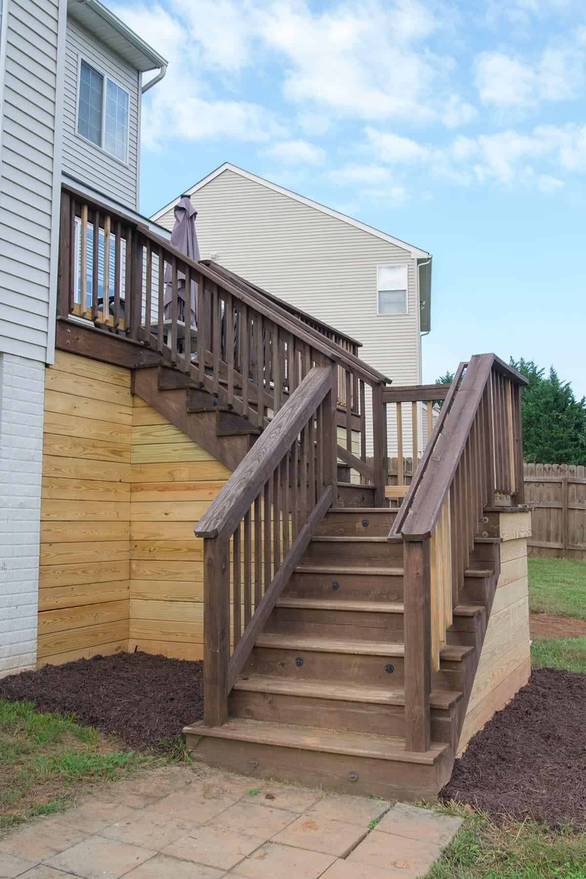 Enclosed deck and around stairs completed with mulch.