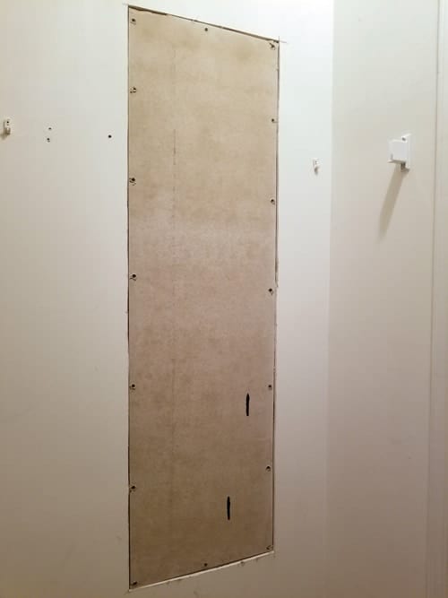 Cement board on dry wall.