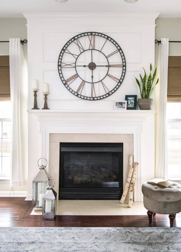 Traditional Mantle with Wainscoting Trim and large clock. Living Room Makeover Reveal.