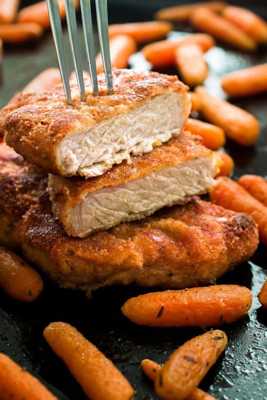 A perfect busy weeknight meal - Oven Baked Parmesan Crusted Pork Chops are crispy and tender and so simple to make! Moist and oven baked to perfection.
