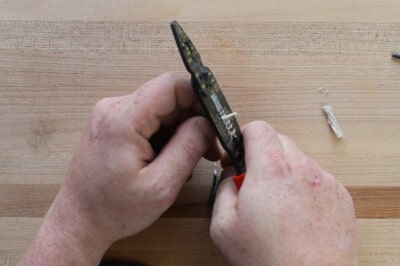 Closeup of stripping wires with a wire multi tool.