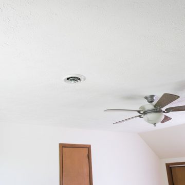 A freshly painted white textured ceiling