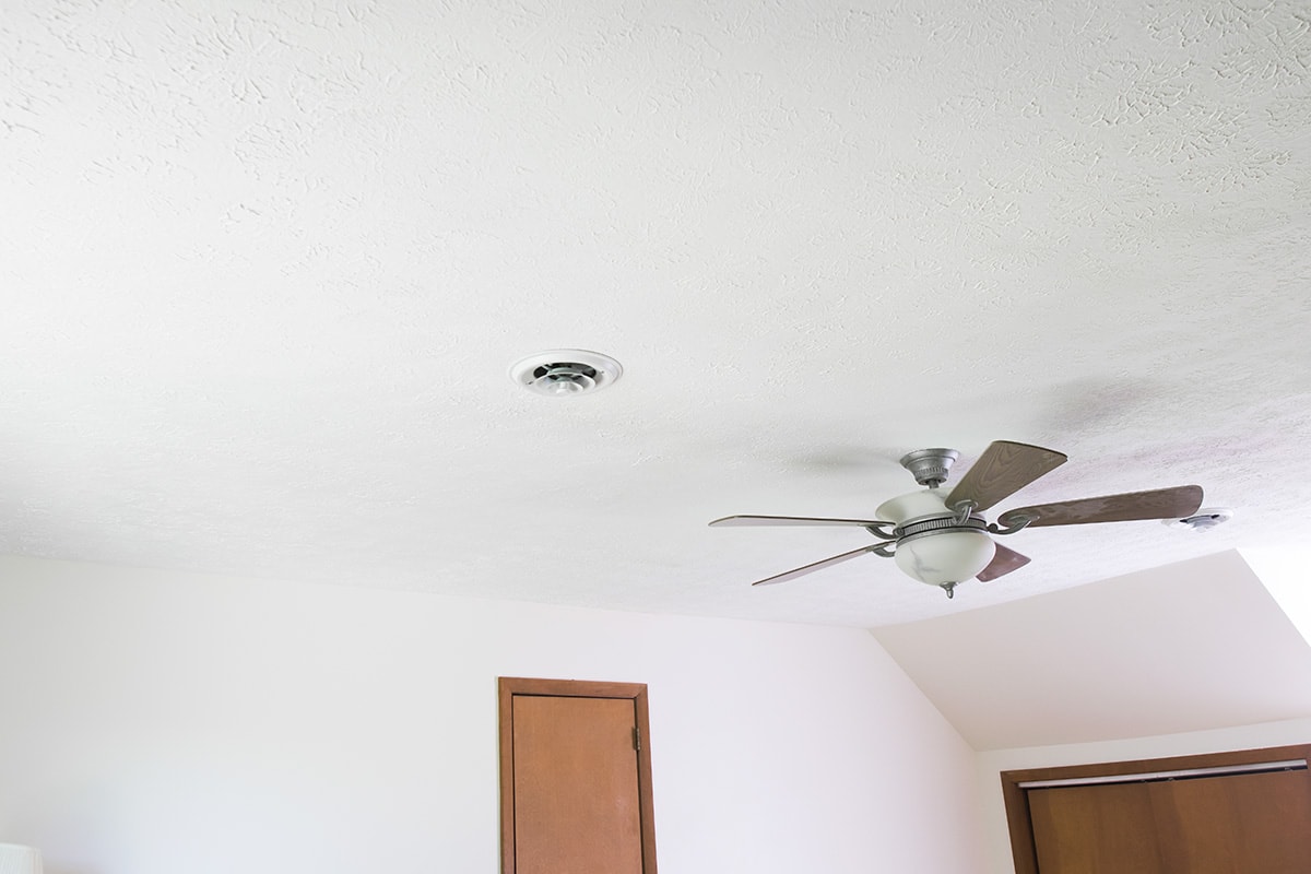 A freshly painted white textured ceiling