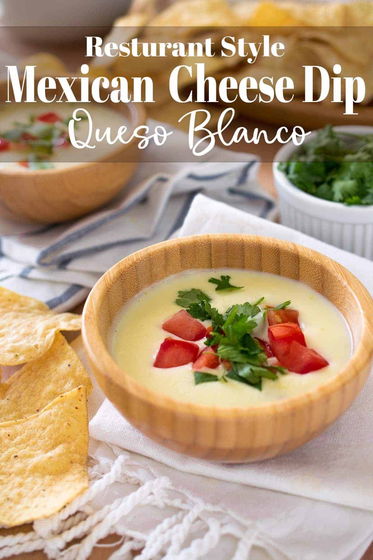 Restaurant style Mexican white Cheese Dip with pico de gallo topping in wooden bowl on dish cloth with chips and title.