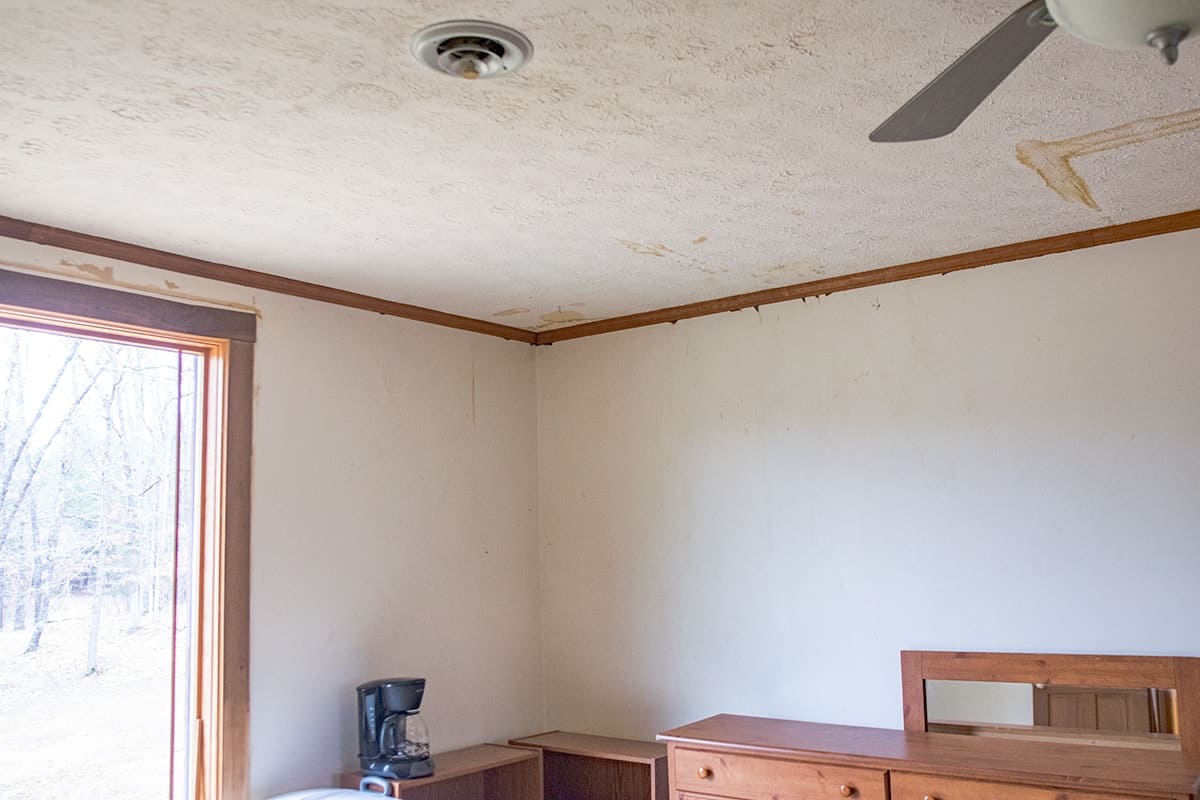 Before photo of water damaged textured ceiling.