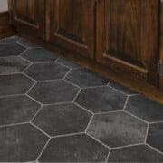 Closeup of vinyl peel and stick floor with groutable tile.