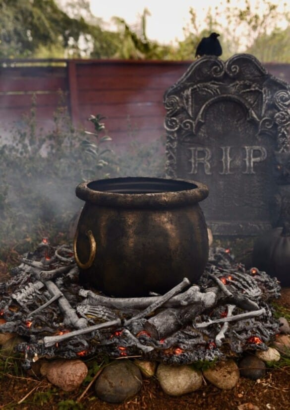 DIY witch's cauldron with realistic fire below.