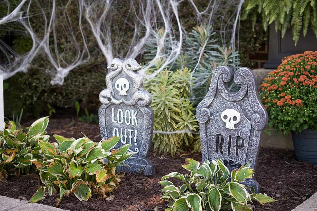 Outdoor Graveyard Decoration Idea with spider webs.