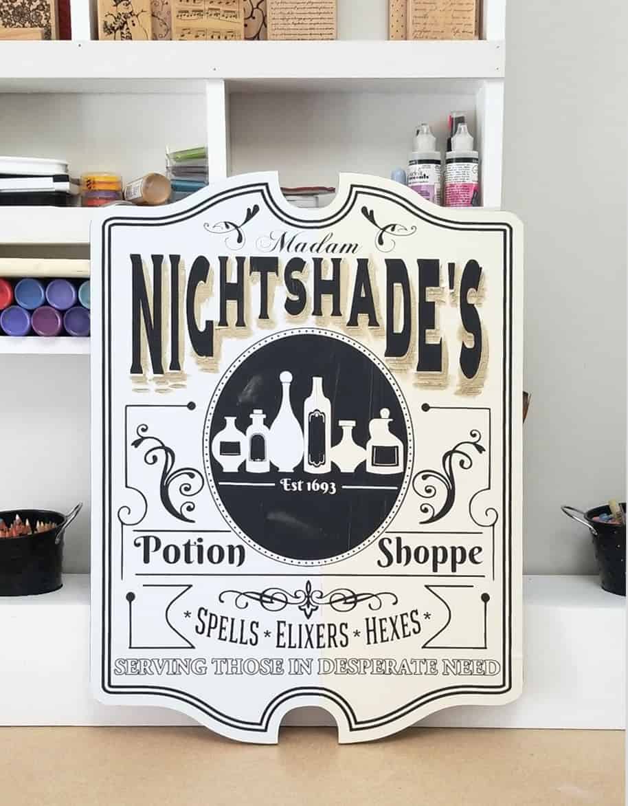 A stencil on a wood board in preparation for painting.