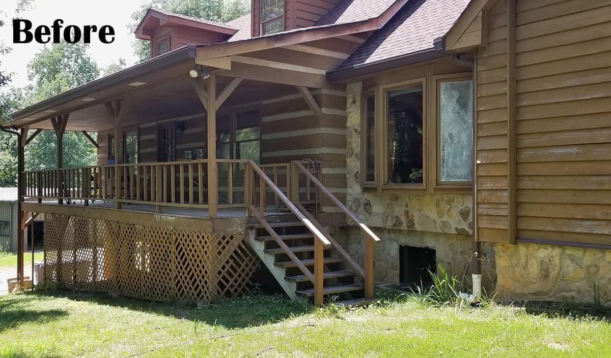 A deteriorating log cabin house that needs to be stained and cleaned up.