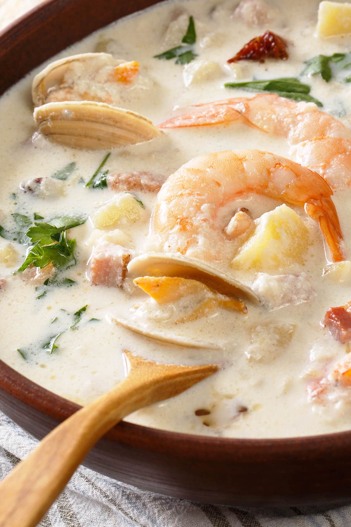 Close up of seafood chowder with mussels and shrimp.