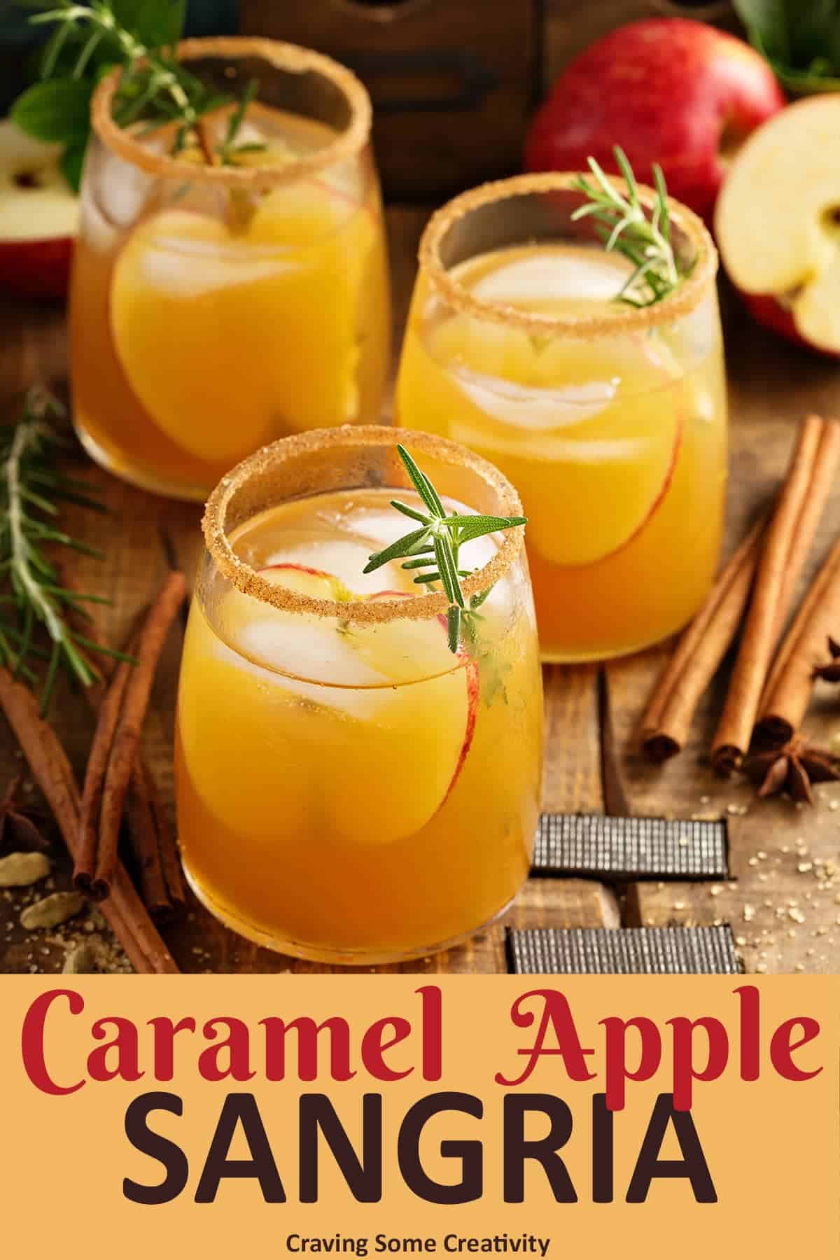 Glasses of Carmel Apple Sangria for fall cocktail garnished with rosemary.