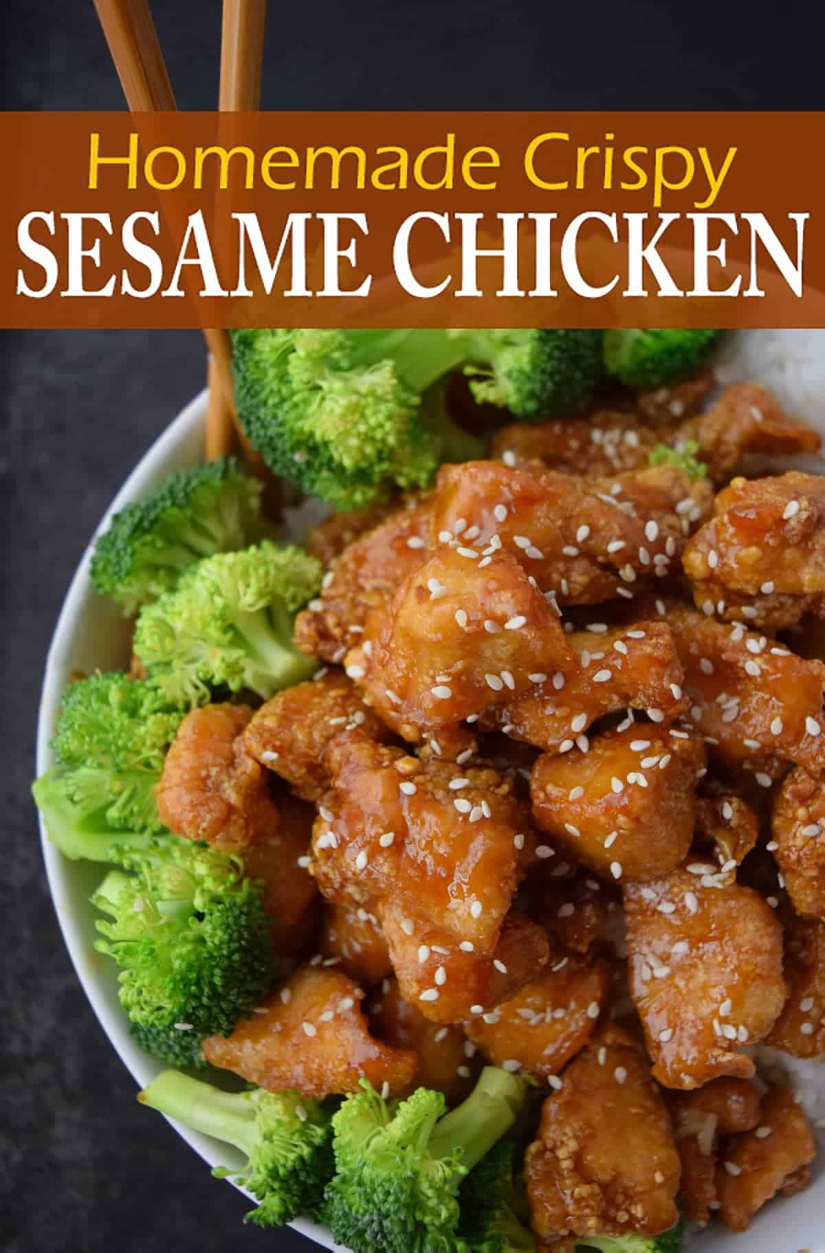 Glazed honey sesame chicken with sesame seeds in white bowl with broccoli with wooden chopsticks on black surface with recipe title. 