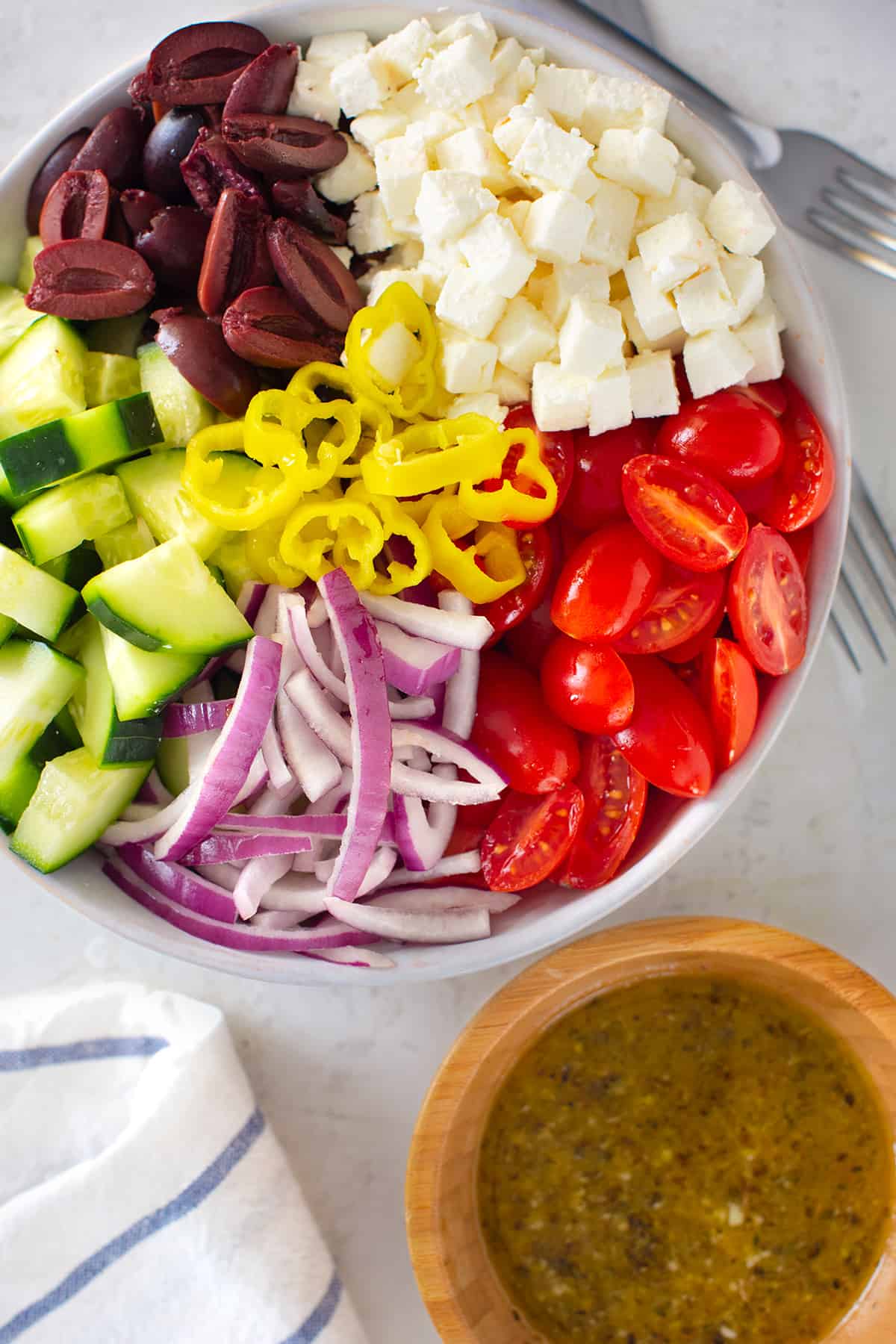 Overhead of vegetables in a chopped salad to show texture and bite sized cuts.