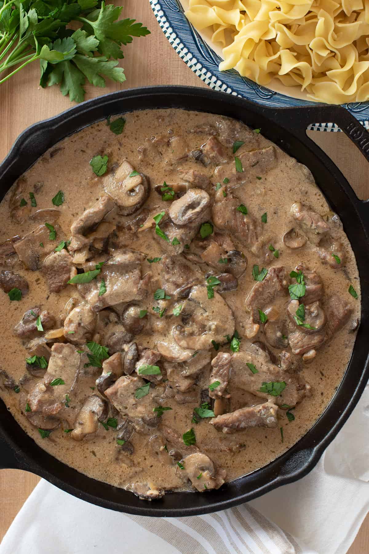 Beef and Mushroom Gravy in a cast iron pan to show color and texture.