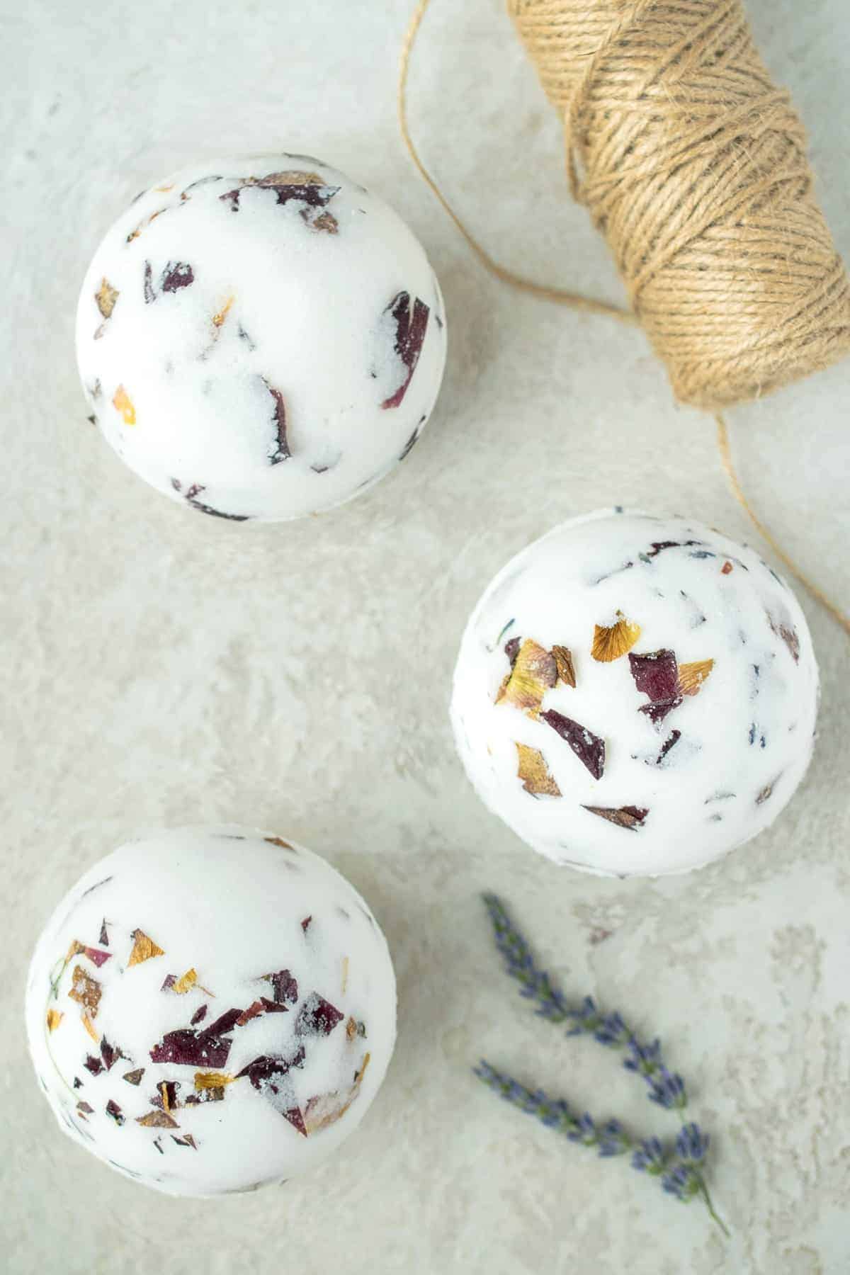 Homemade Bath bombs with rose petals and lavender inside.