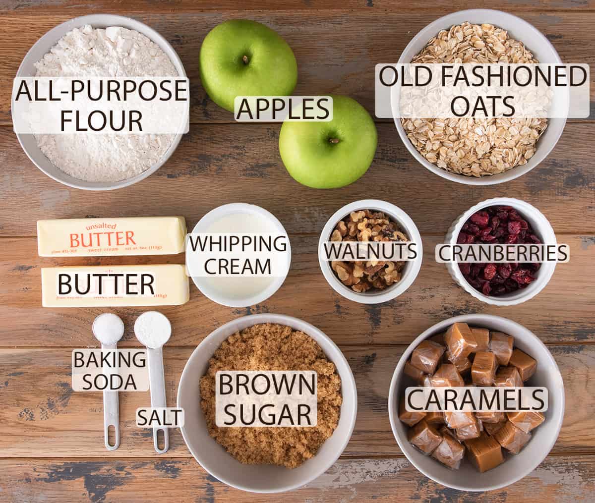 Ingredients for Apple Crumble Bars recipe laid out on table with text labels.