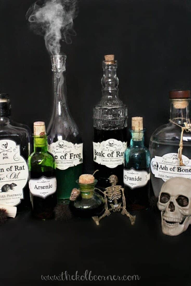 Apothecary bottles with various labels on them for Halloween party décor.