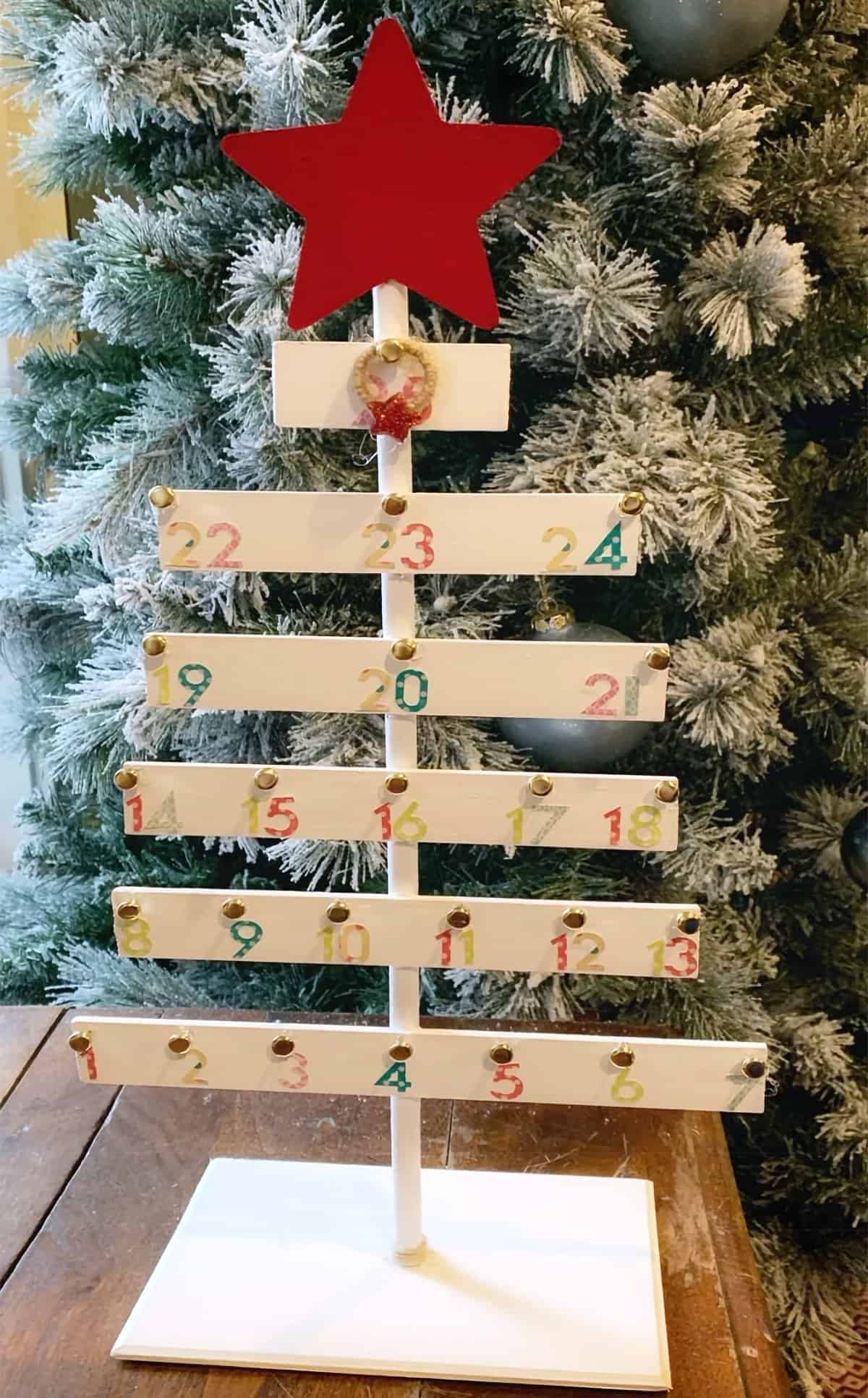 Wooden advent calender made from paint sticks.