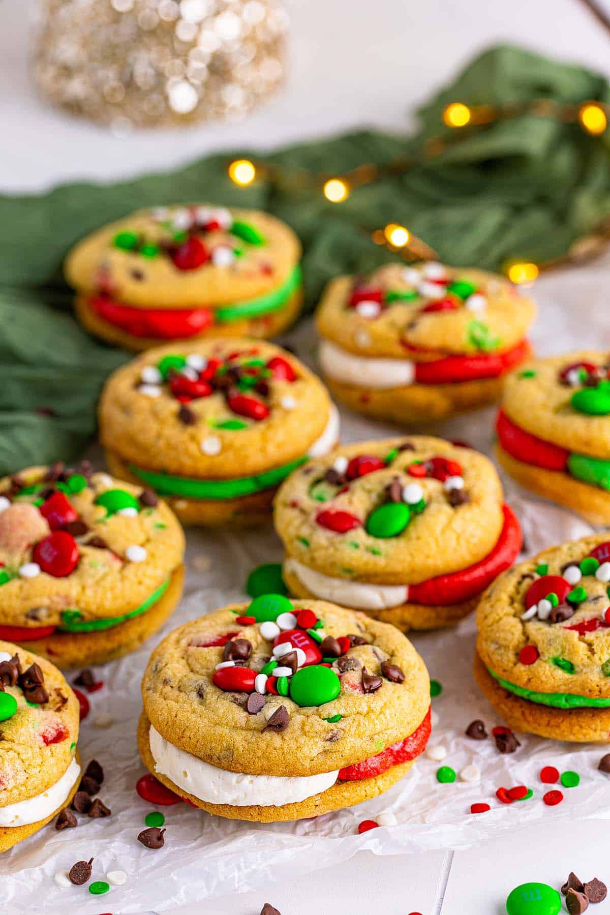 Christmas cookie sandwiches with red and green M&Ms and confetti.