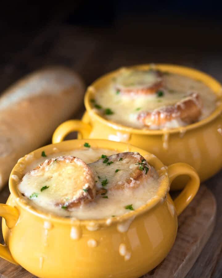 Two bowls of french onion soup.